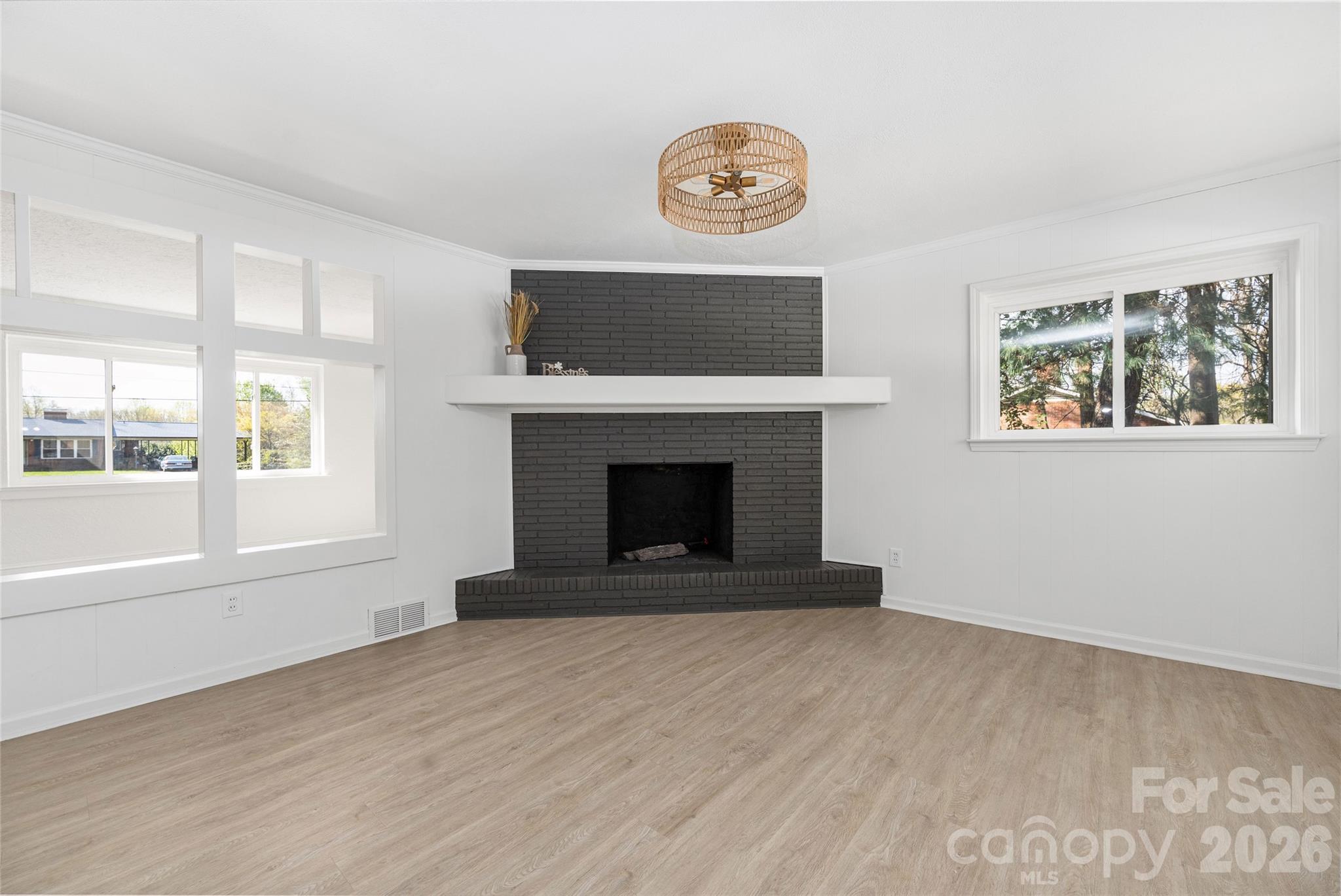 9424 Pembroke Road Huntersville, NC 28078 - Photo 17 of 39 a view of an empty room with a window and fireplace