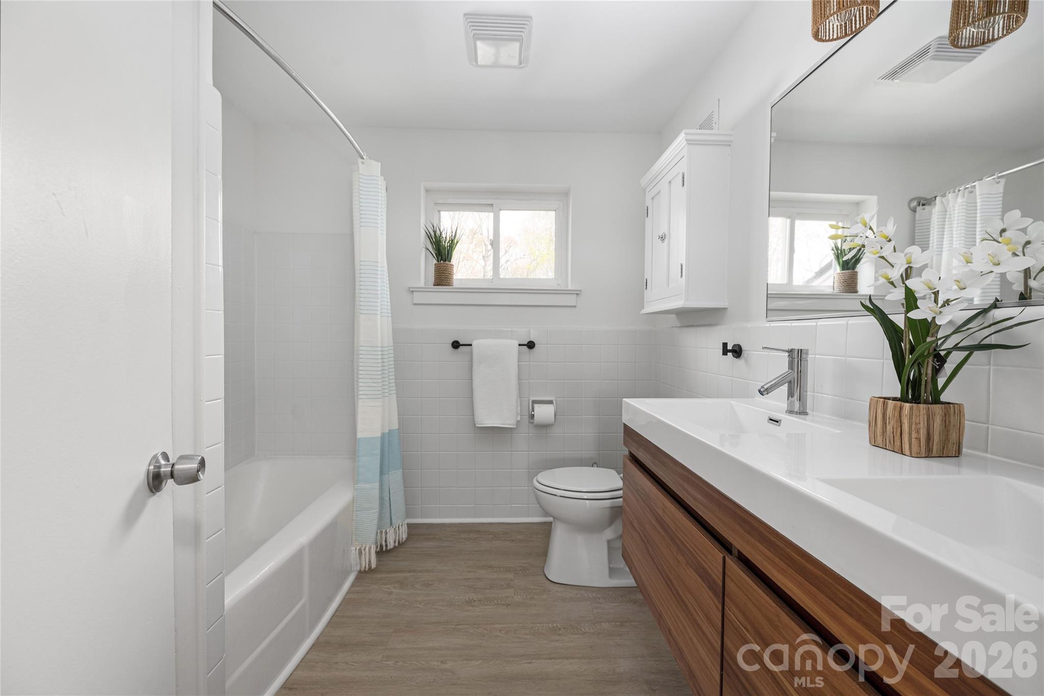 9424 Pembroke Road Huntersville, NC 28078 - Photo 21 of 39 a bathroom with a sink a toilet and shower
