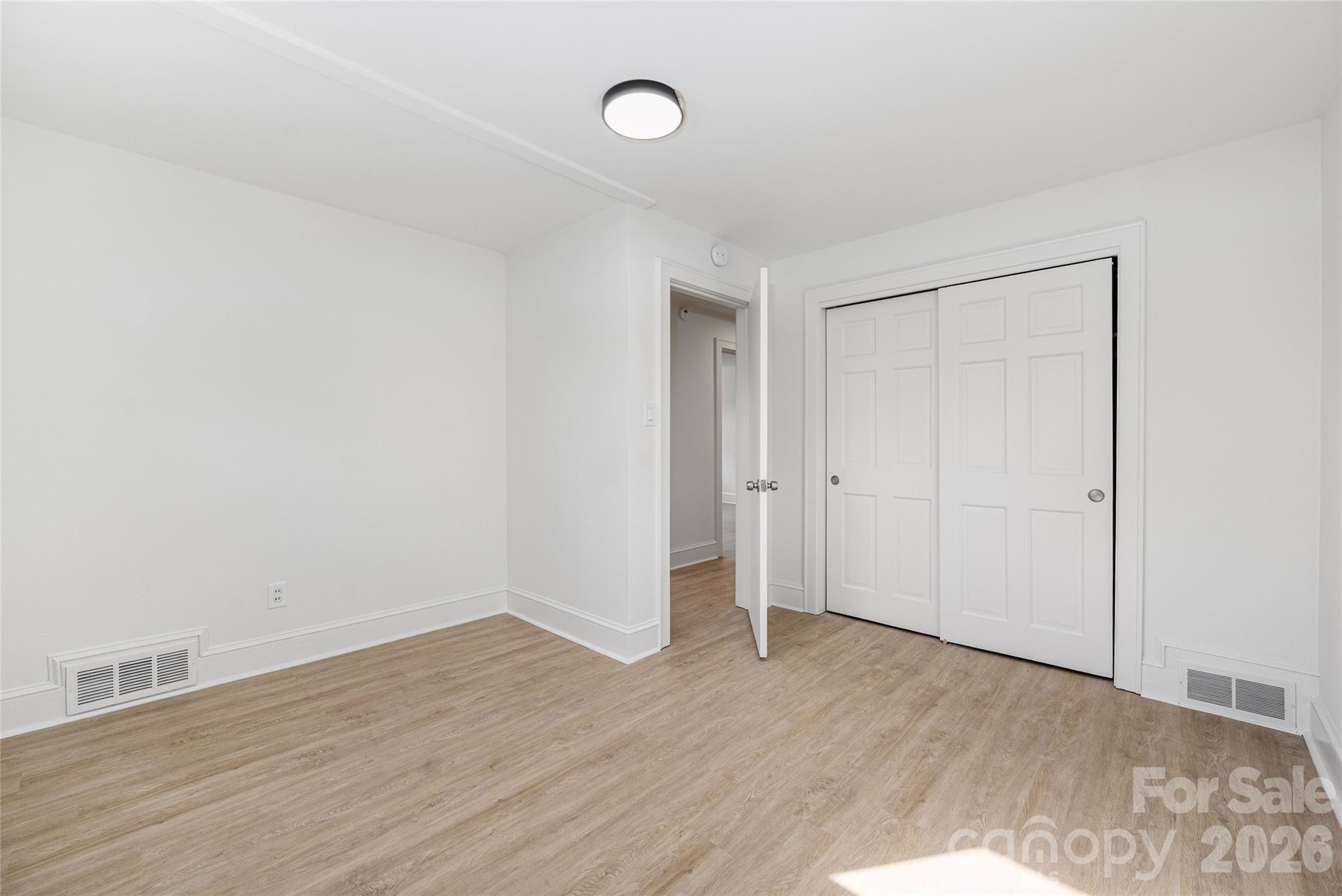 9424 Pembroke Road Huntersville, NC 28078 - Photo 27 of 39 a view of an empty room with wooden floor