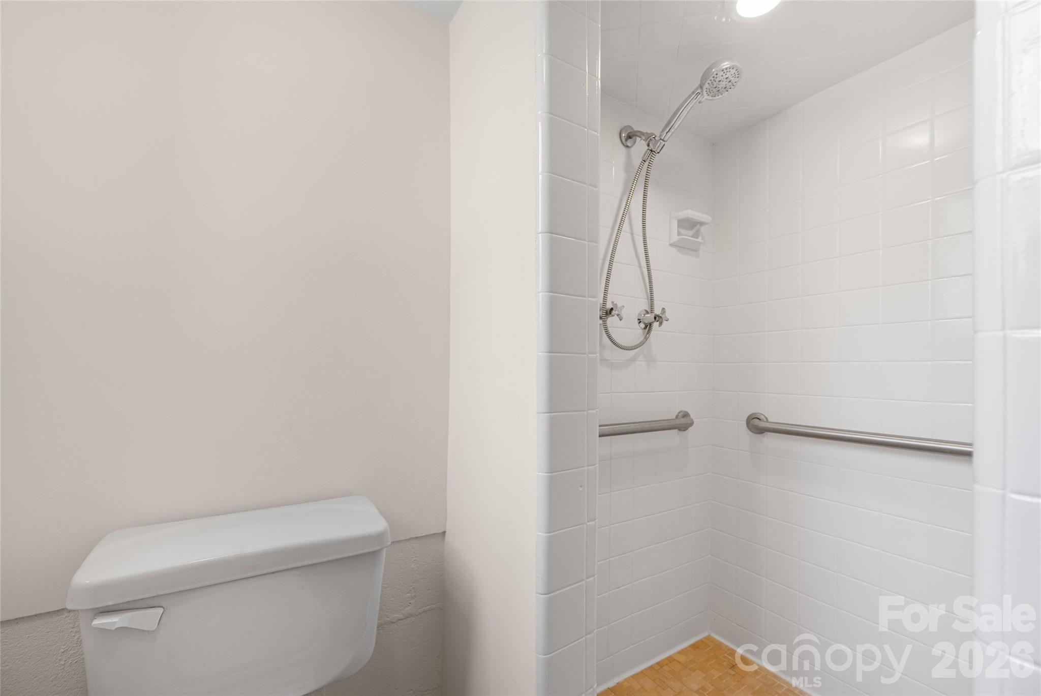 9424 Pembroke Road Huntersville, NC 28078 - Photo 32 of 39 a bathroom with a shower and toilet