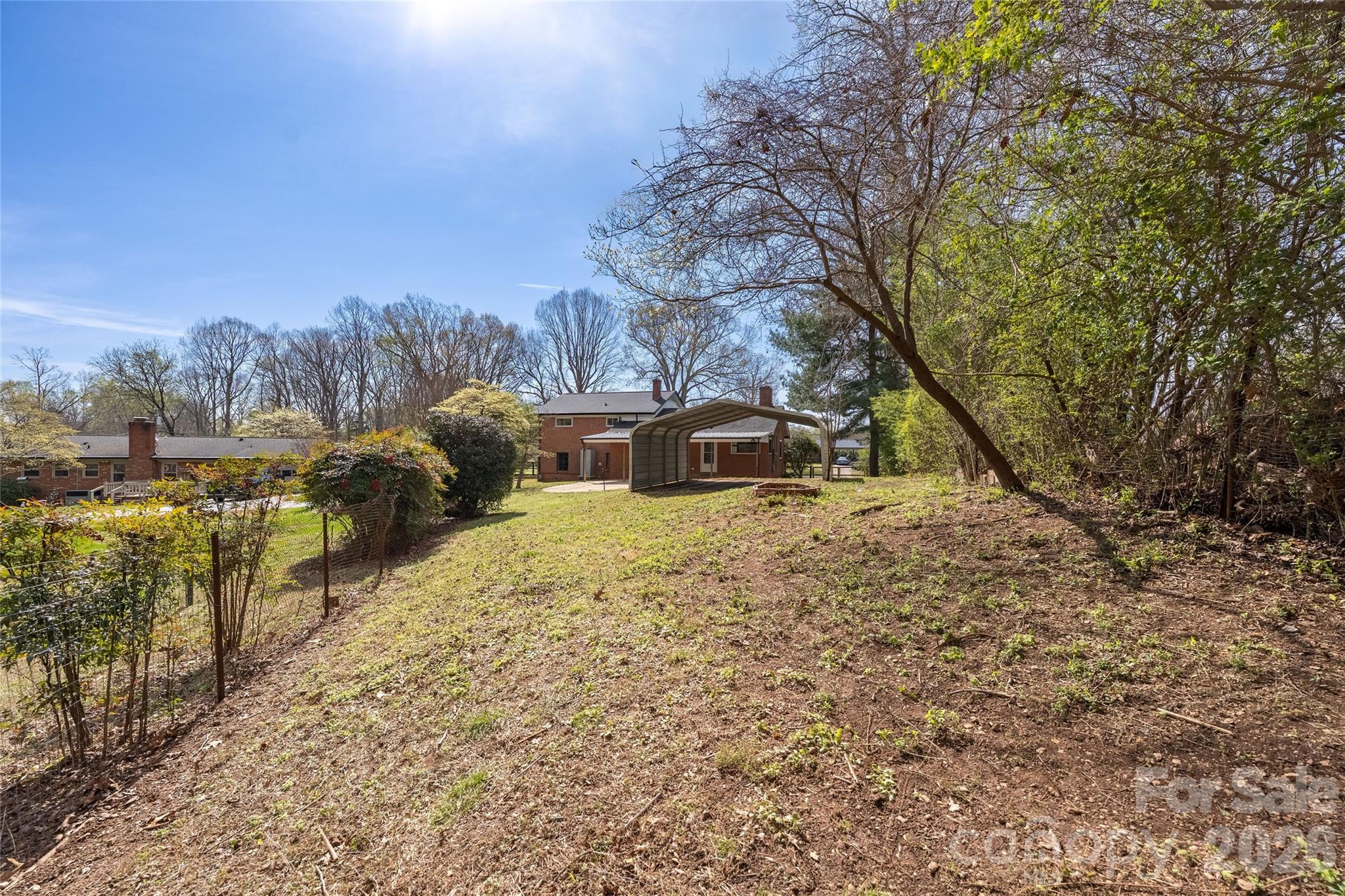 9424 Pembroke Road Huntersville, NC 28078 - Photo 35 of 39 a view of a yard with wooden fence