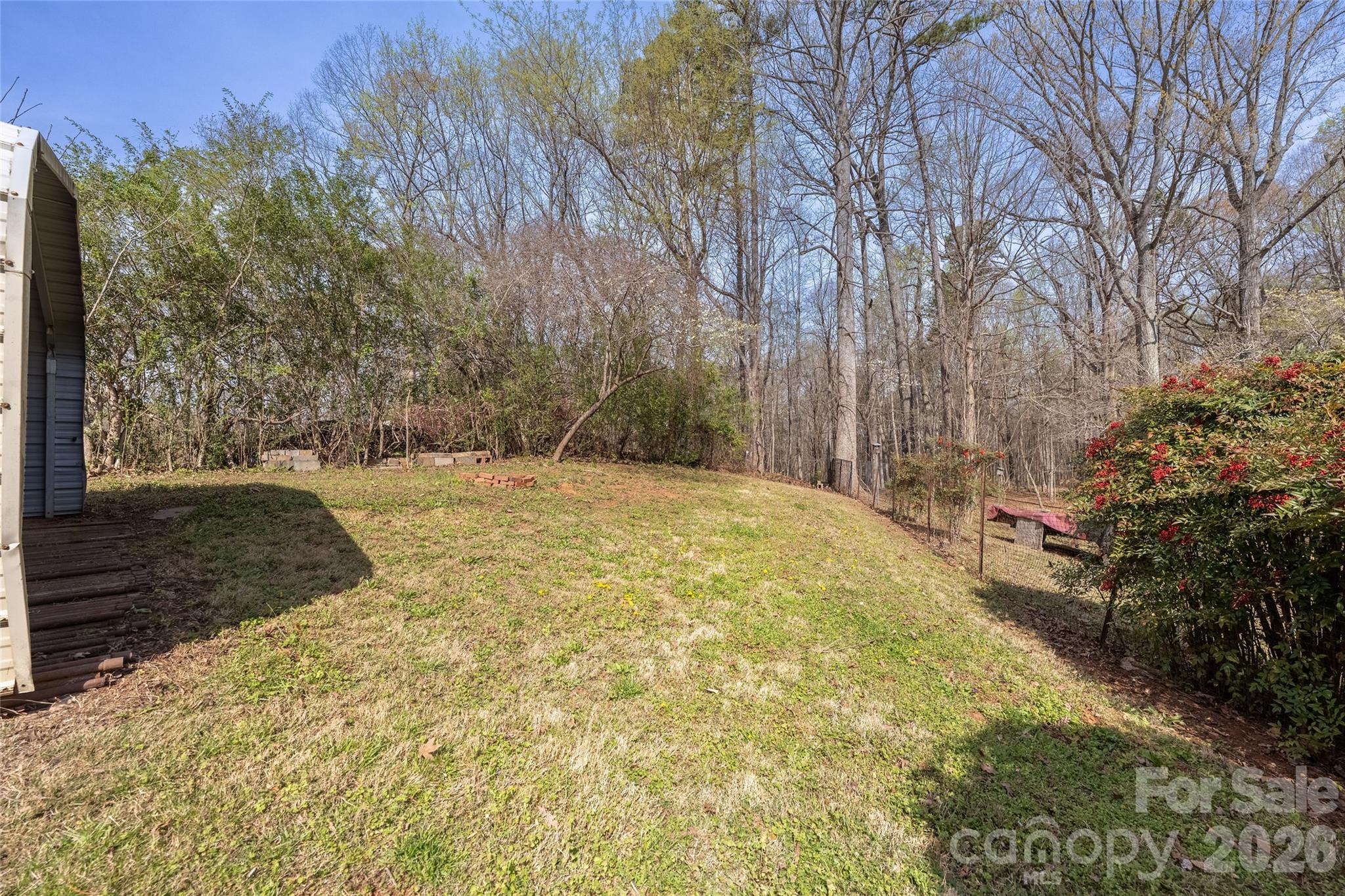 9424 Pembroke Road Huntersville, NC 28078 - Photo 36 of 39 a view of a yard with large trees
