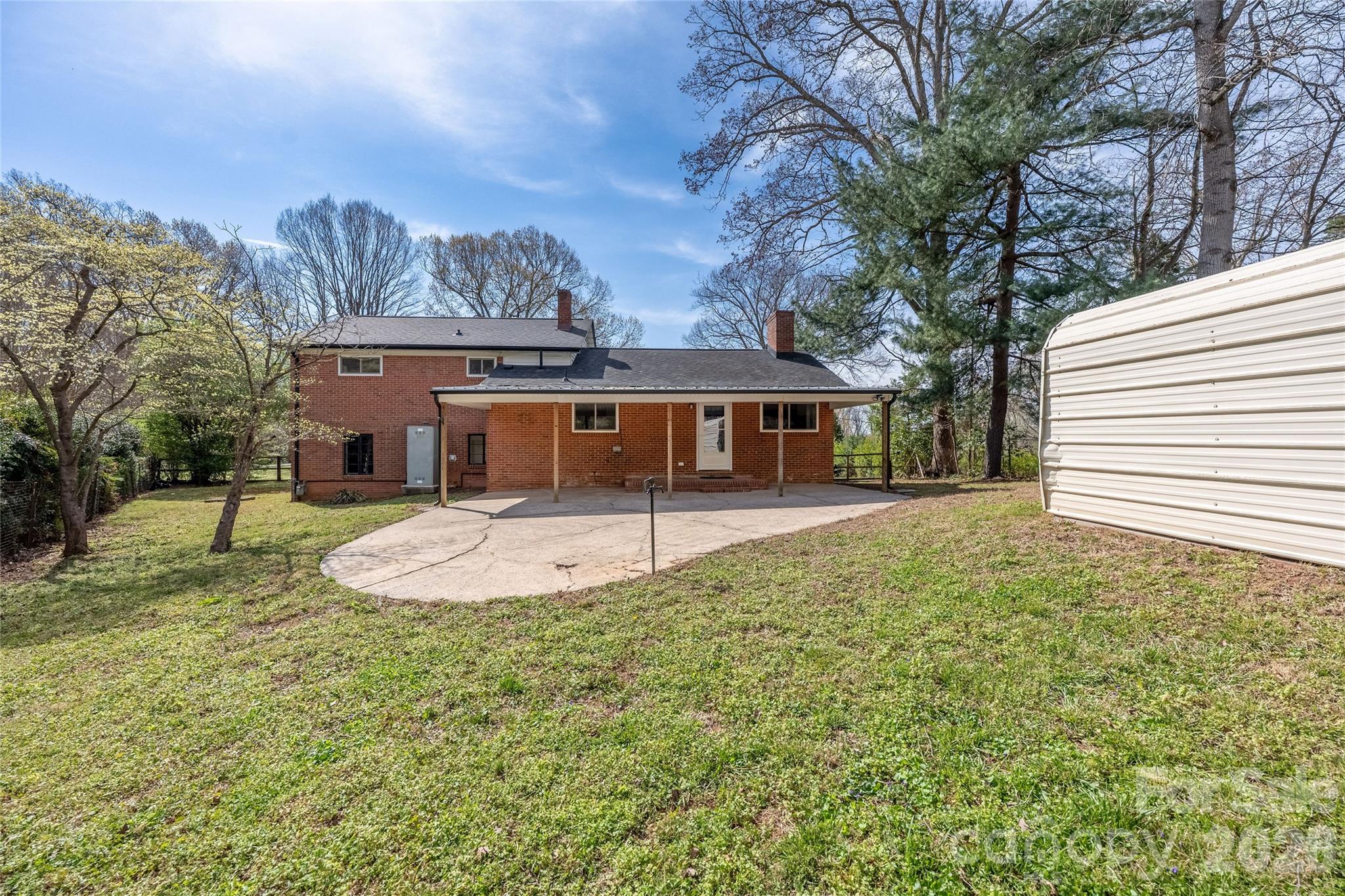 9424 Pembroke Road Huntersville, NC 28078 - Photo 37 of 39 a front view of a house with a yard and trees