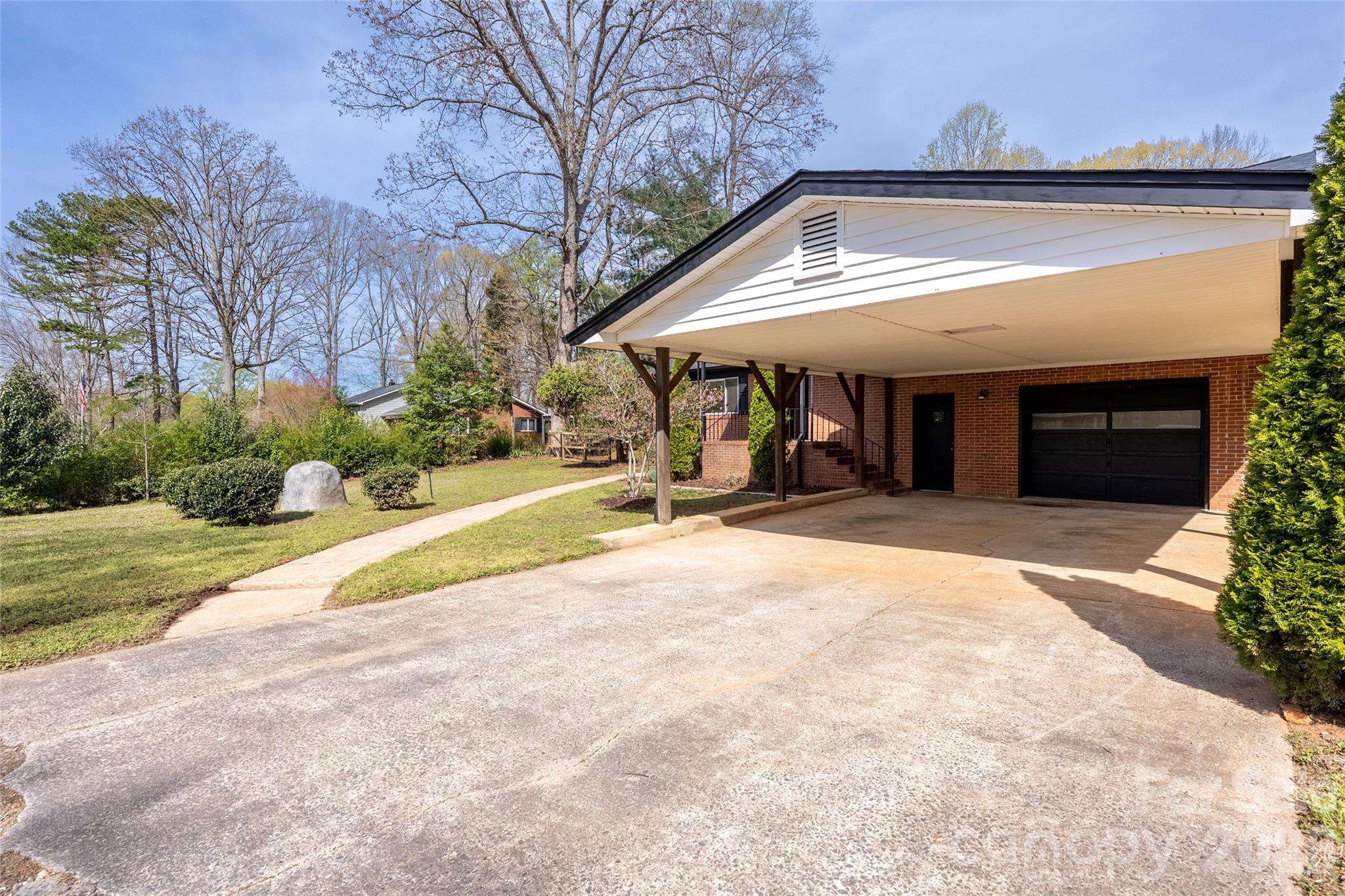 9424 Pembroke Road Huntersville, NC 28078 - Photo 4 of 39 a view of a house with backyard and trees