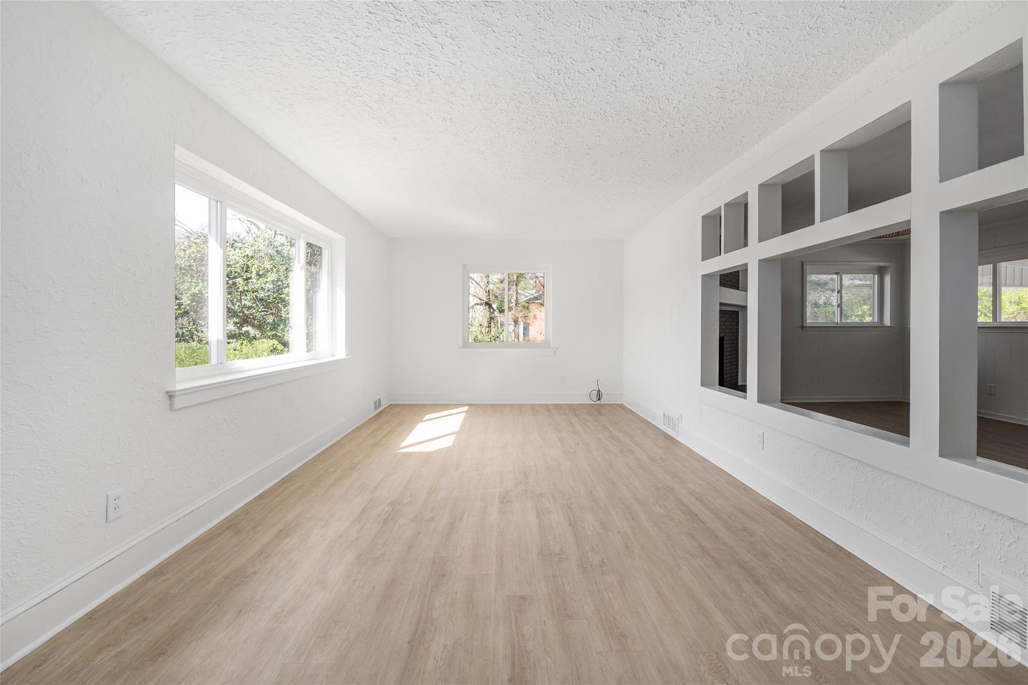 9424 Pembroke Road Huntersville, NC 28078 - Photo 9 of 39 a view of empty room with windows