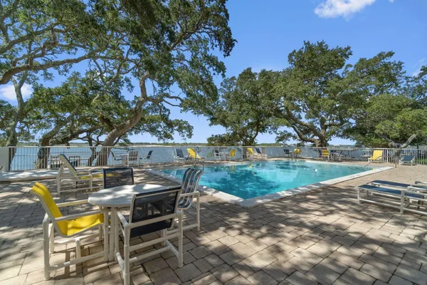 a view of a swimming pool with a patio