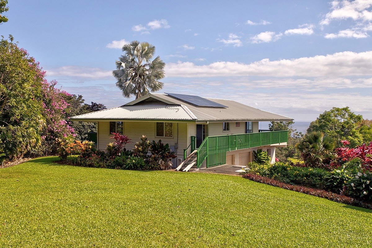 27-451 La Road Papaikou, HI 96781 - Photo 1 of 30 a front view of a house with garden