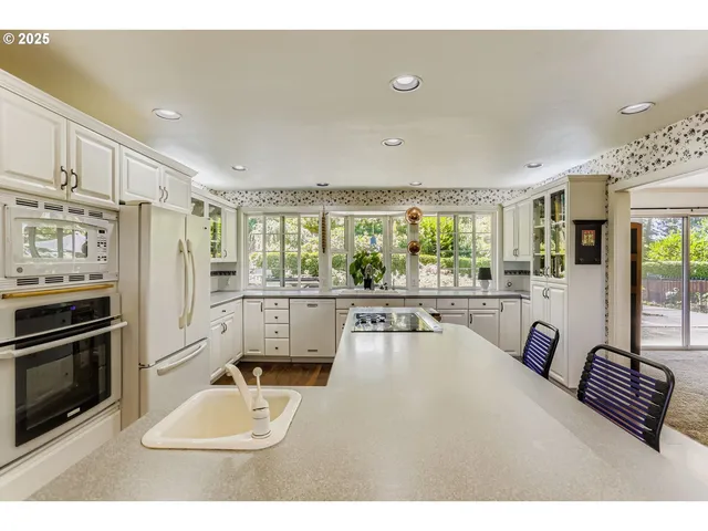 a living room with furniture large window and flat screen tv