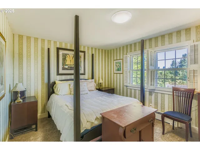 a balcony with table and chairs