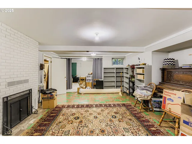 a view of a livingroom with furniture flat screen tv and staircase