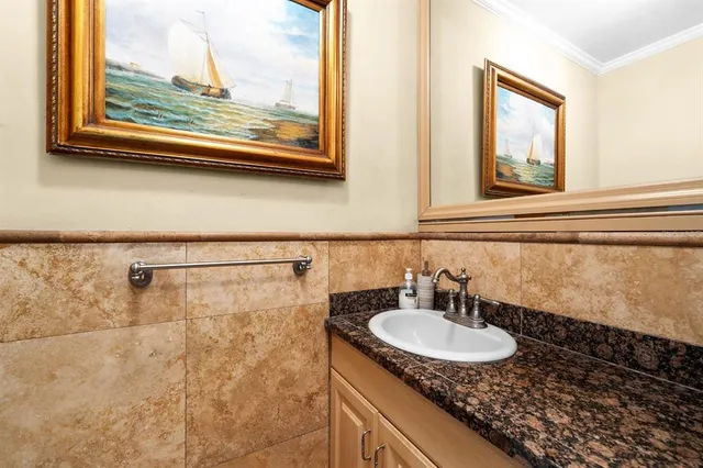 a living room with furniture a large window and flat screen tv