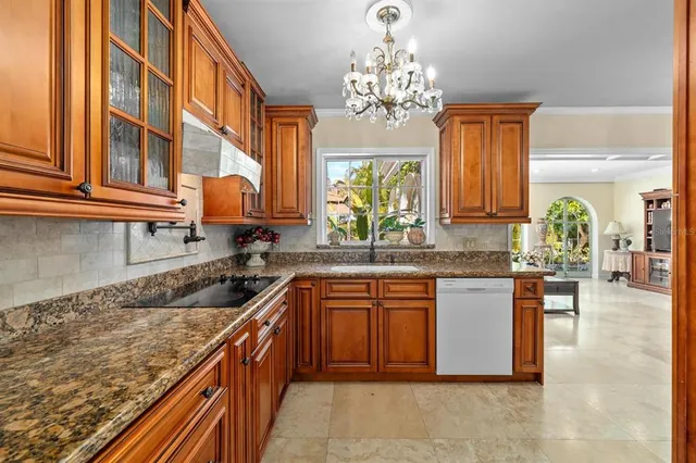 a view of a patio with table and chairs and potted plants