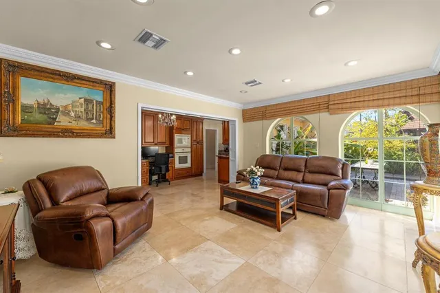 a view of a chairs and table in the patio