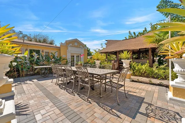 a view of a patio with chairs and tables