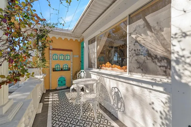 an aerial view of multiple houses with yard