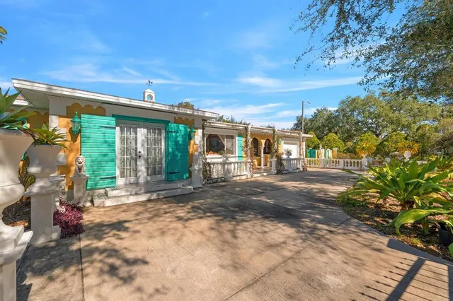 an aerial view of residential houses with city view