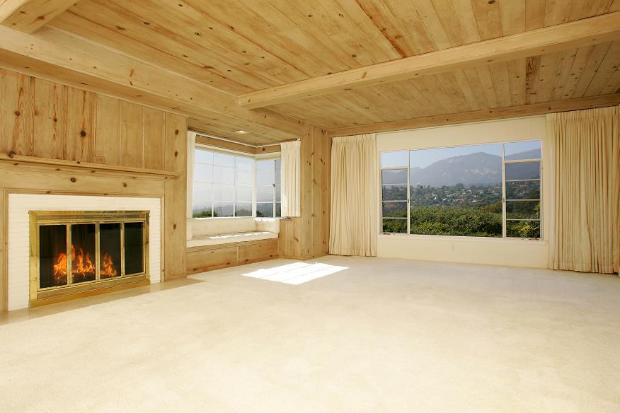 2174 Mission Ridge Road Santa Barbara, CA 93103 - Photo 3 of 12 a view of an empty room with a fireplace and a window