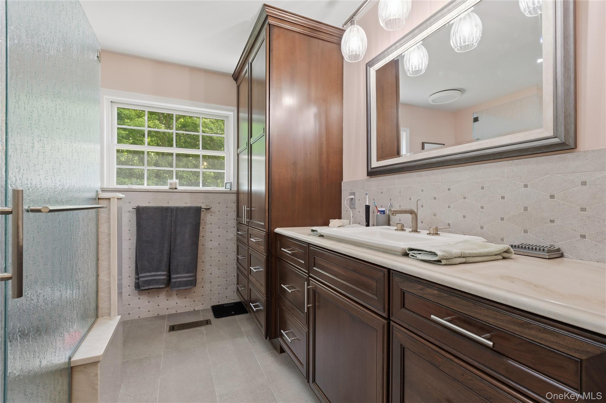 239-241 Fosler Road Highland, NY 12528 - Photo 9 of 42 Bathroom with wood-finish cabinetry and a light countertop