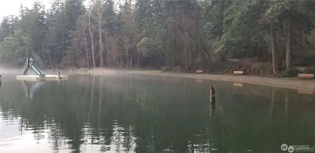 a view of a table and chairs under an umbrella