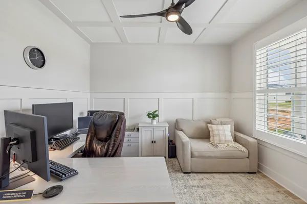 a living room with furniture flat screen tv and a fireplace