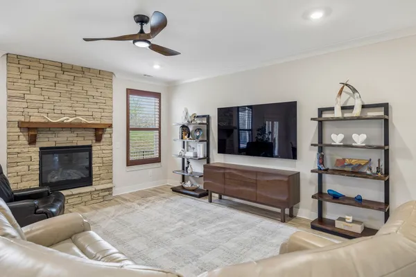 a kitchen with stainless steel appliances granite countertop stove top oven and cabinets