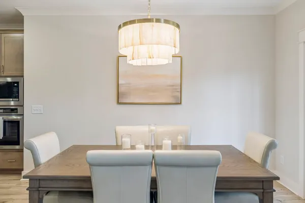a kitchen with stainless steel appliances granite countertop stove top oven and cabinets