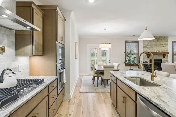 a bathroom with a granite countertop sink mirror and double