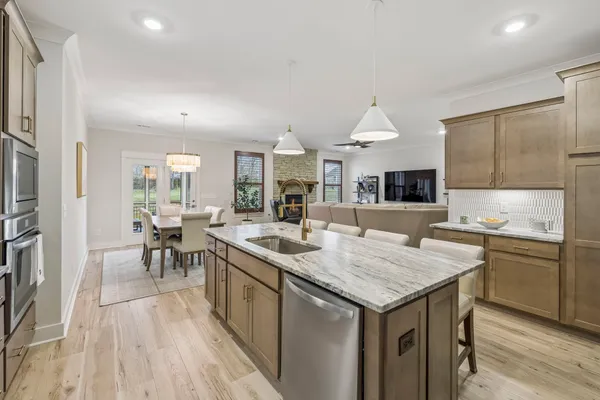 a bathroom with double vanity sinks and a mirror
