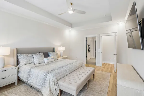 a view of walk in closet with clothes