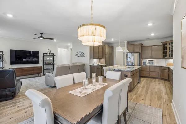 a bedroom with bed and a large window