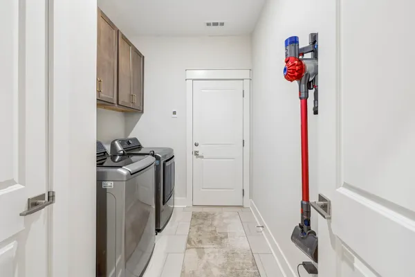a bedroom with bed and a flat screen tv