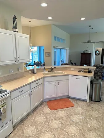 a kitchen with stainless steel appliances granite countertop a sink and cabinets