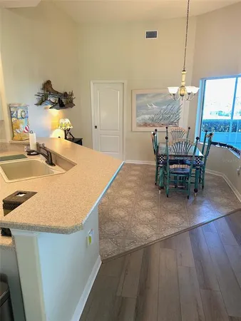 a dining room with furniture and wooden floor