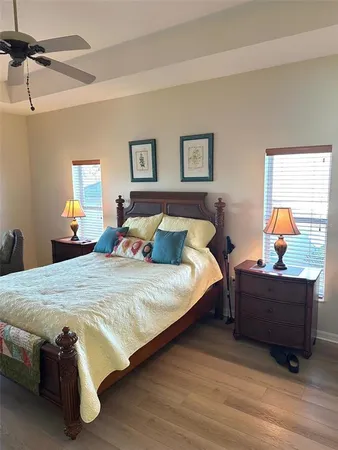 a bedroom with bed and window