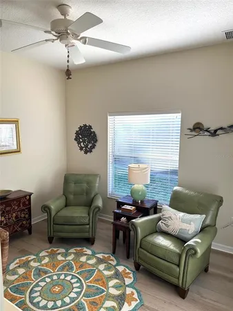 a living room with furniture and a rug