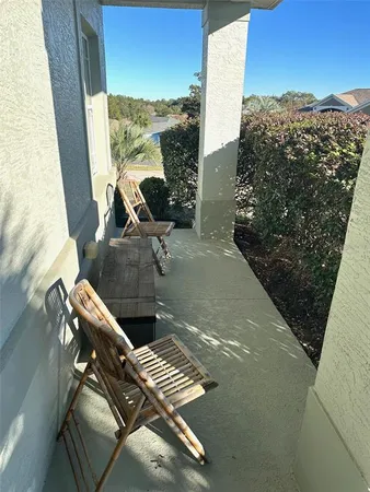 a view of a balcony with chairs