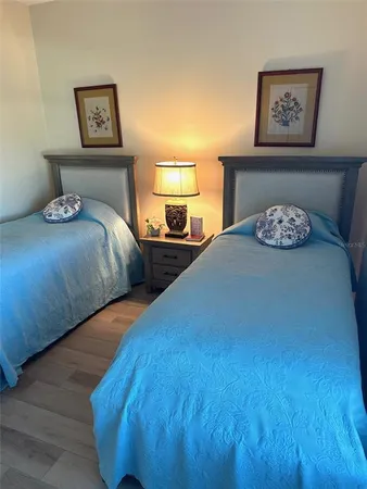 a bedroom with double bed and a night stand