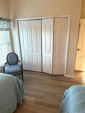 a bedroom with a bed and a mirror