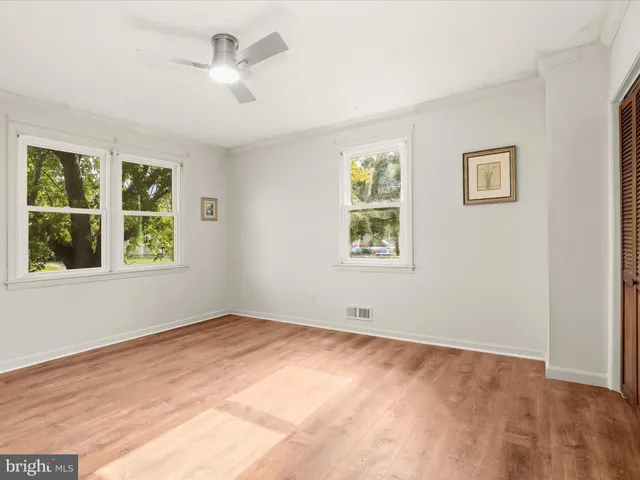 a view of empty room with windows