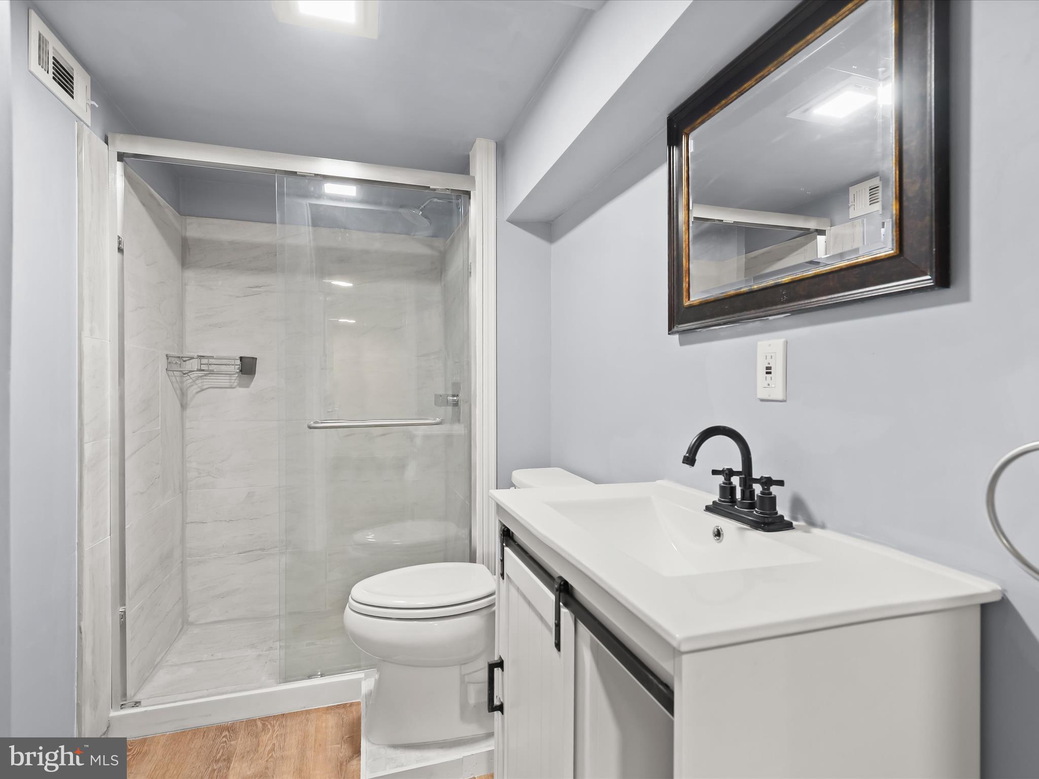 2608 Ambler Road Dundalk, MD 21222 - Photo 26 of 34 a bathroom with a sink toilet and shower