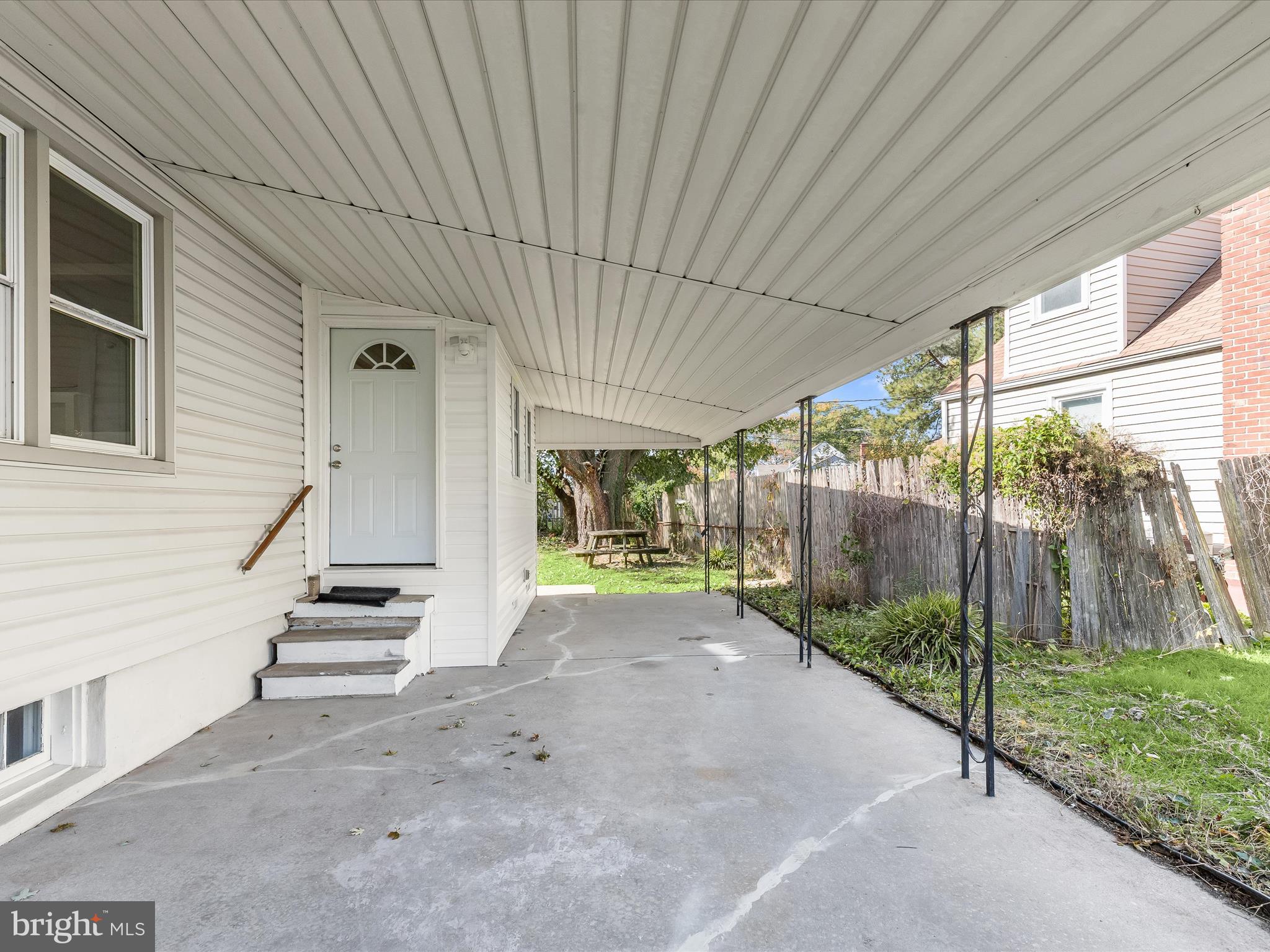 2608 Ambler Road Dundalk, MD 21222 - Photo 27 of 34 a view of a house with backyard and wooden fence