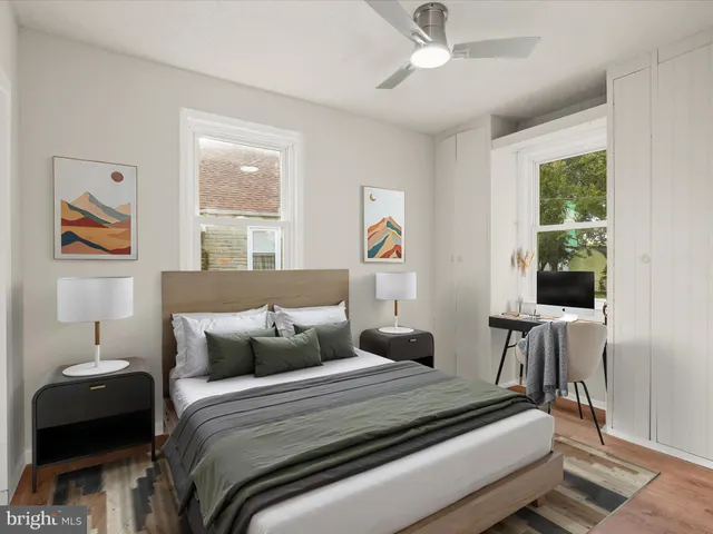 a bedroom with bed and a window