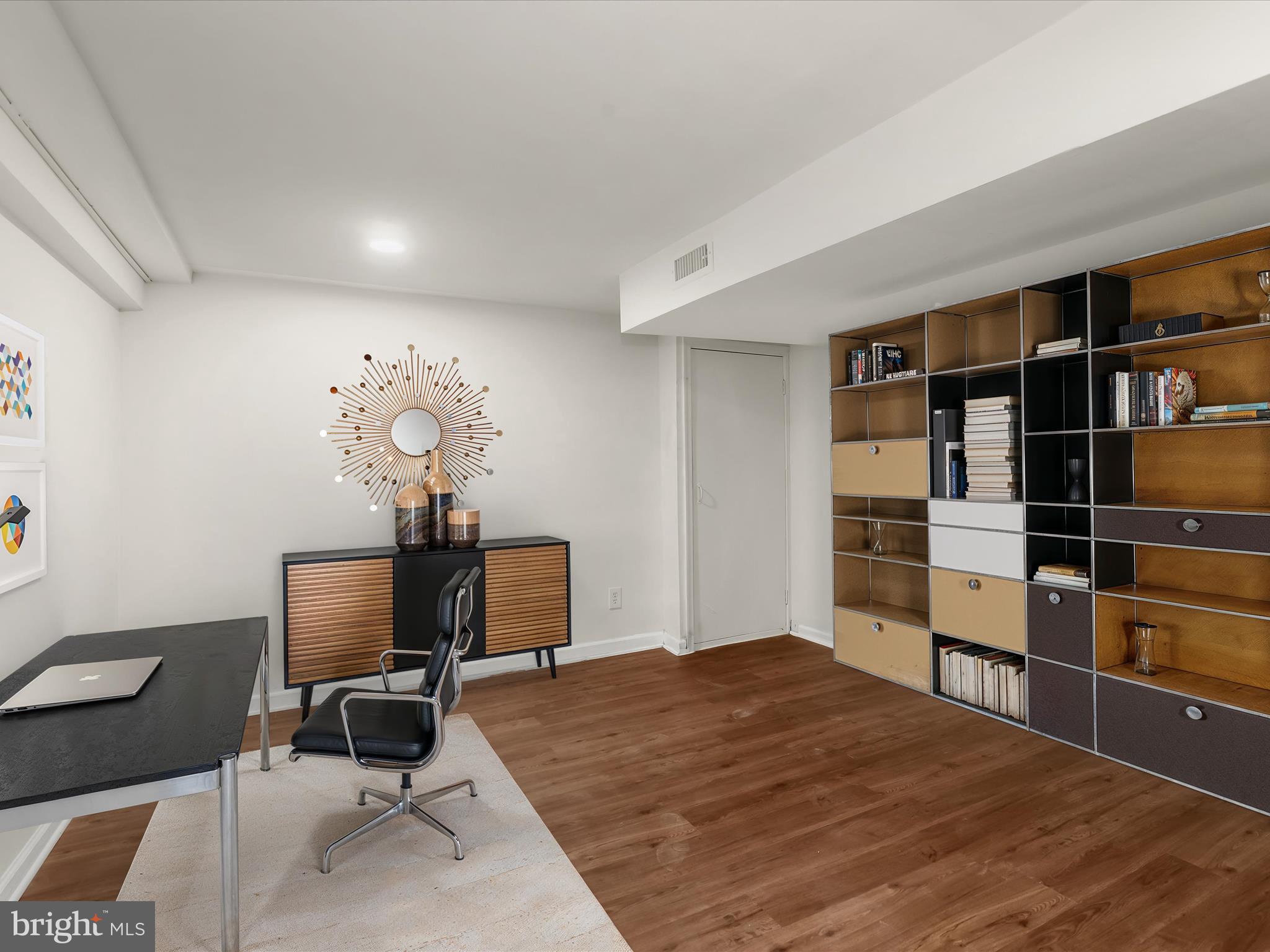 2608 Ambler Road Dundalk, MD 21222 - Photo 6 of 34 a bed room with a bed and a chair in it