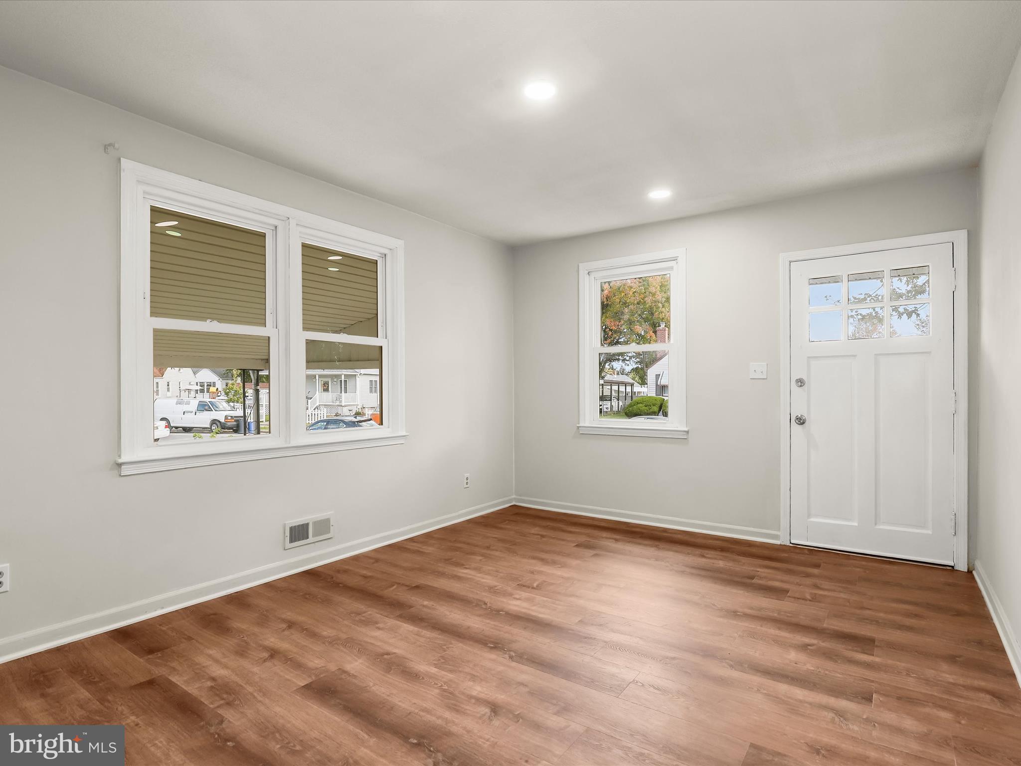2608 Ambler Road Dundalk, MD 21222 - Photo 8 of 34 a view of empty room with window and wooden floor