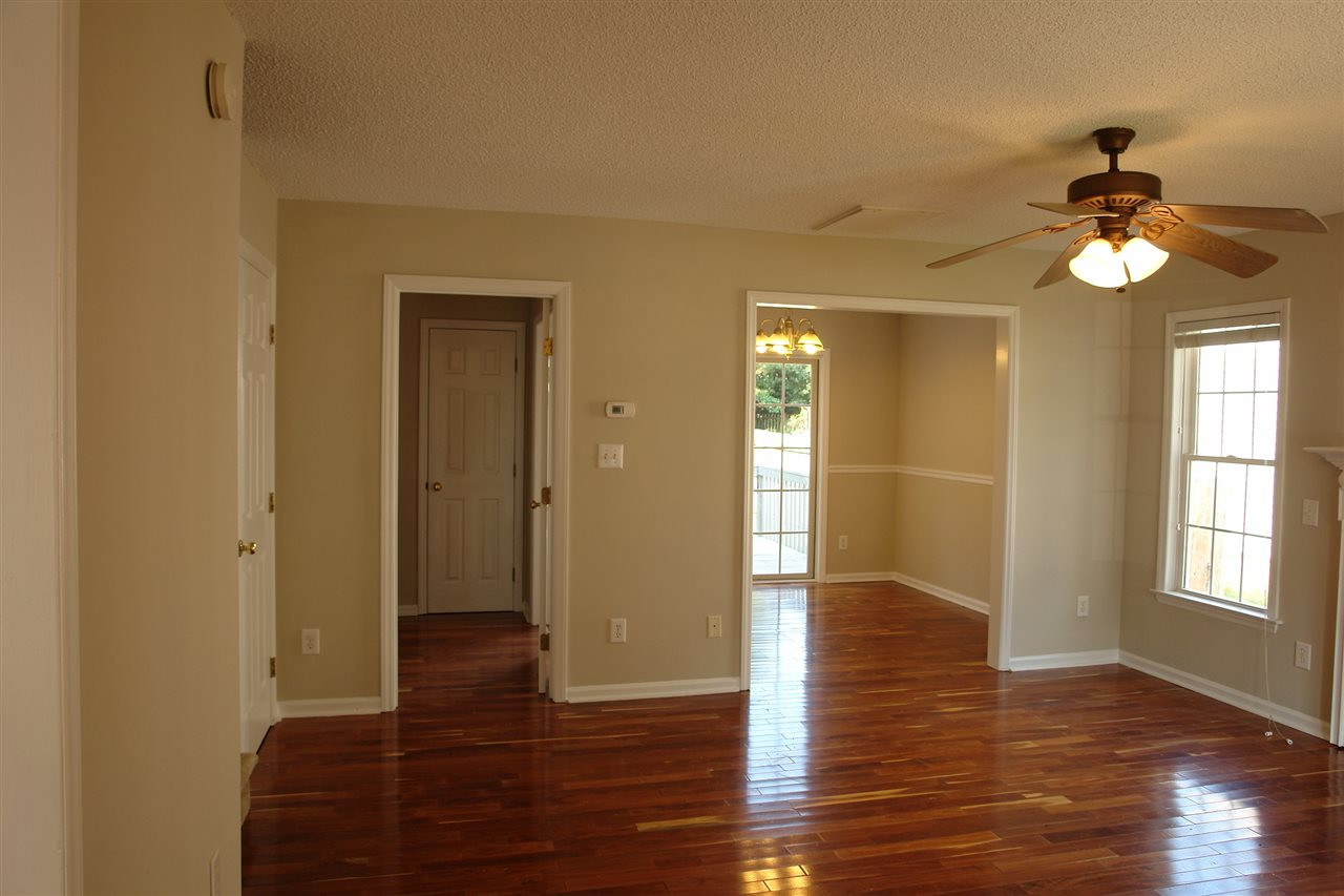 8317 Neuse Rapids Road Raleigh, NC 27616 - Photo 5 of 25 View from the entryway looking toward the Living Room (w/fireplace) and into Dining Room. The doorway to the left leads to Kitchen. Entry
