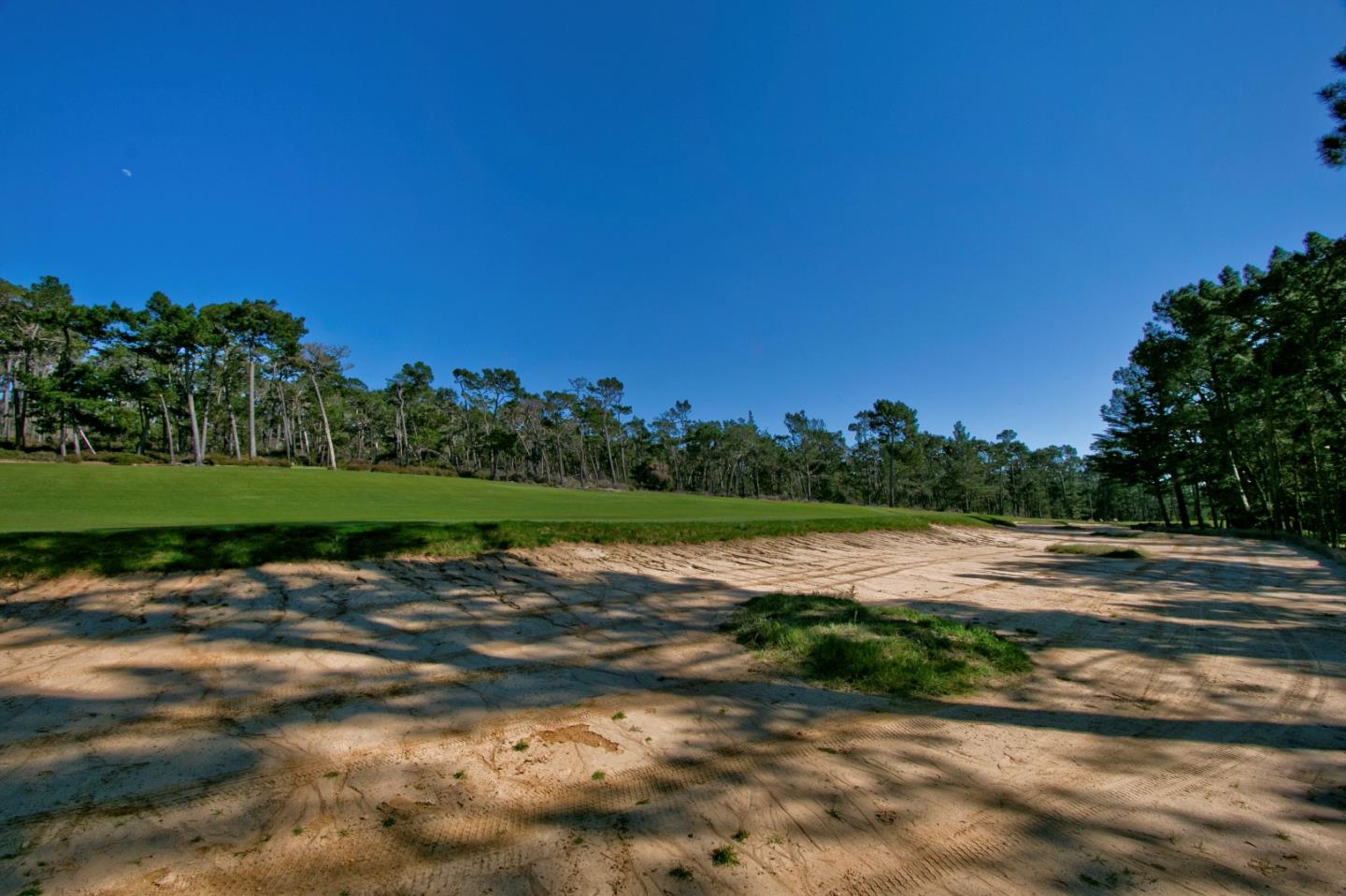25 Poppy Ln. Lane Pebble Beach, CA 93953 - Photo 1 of 5 a view of a lake with houses in the background