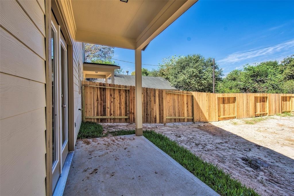 8142 Cabot Street, Unit A Houston, TX 77078 - Photo 19 of 21 a view of a backyard with wooden fence