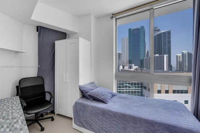 a view of a city with tall buildings