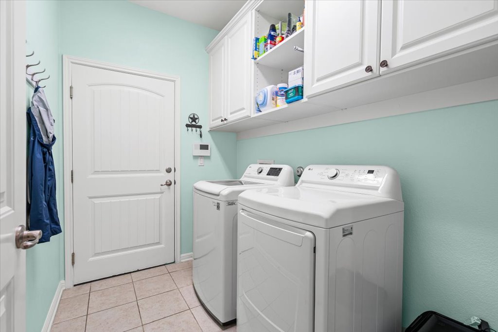5912 Corrine Lane Austin, TX 78747 - Photo 20 of 27 Laundry room with built in storage cabinets
