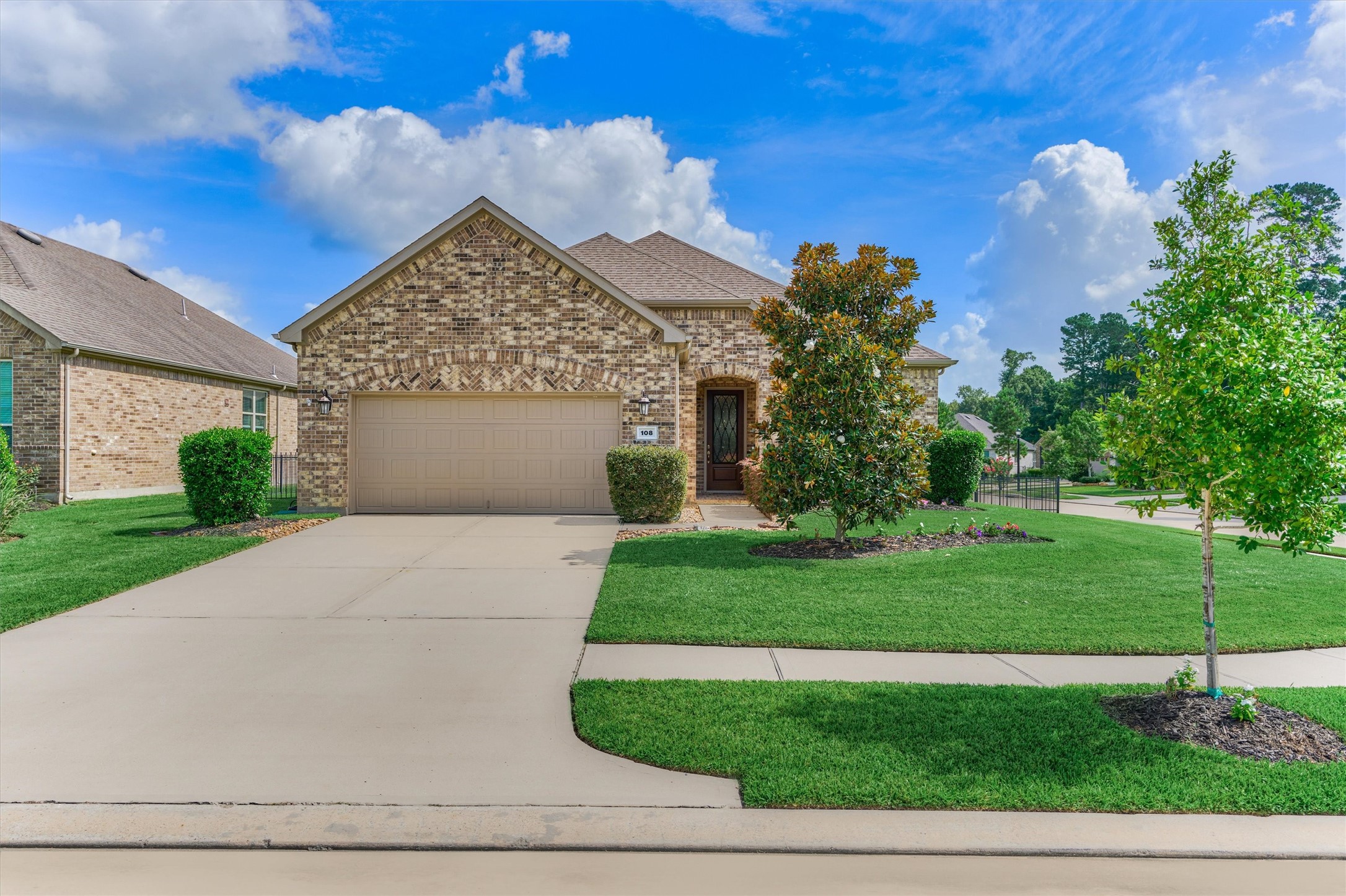 108 Wild Wick Way Spring, TX 77382 - Photo 6 of 44 Tasteful Landscaping Compliments The Handsome Brick Elevation; Please Note That The Home Has Generator Connections For Natural Gas Powering And For The Electrical Feed To The Home.